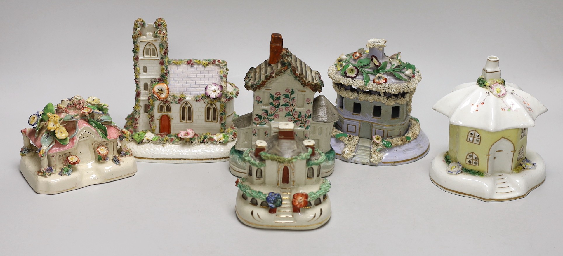 Five Staffordshire porcelain or pottery cottage or church pastille burners and a similar cottage money box, Tallest 14.5cm